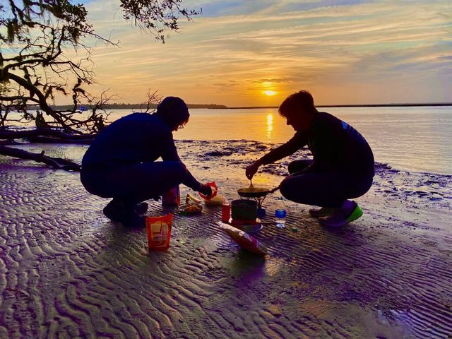 Lewis and Charles cooking dinner at sunset, Brickhill Bluff, Cumberland Island, January 2020. This photo so brilliantly captures the essence of Scouting!